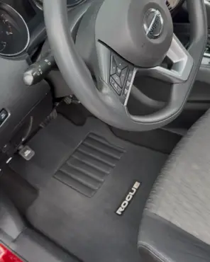 The same Nissan Rogue footwell with the mat cleaned and the console and vents wiped down